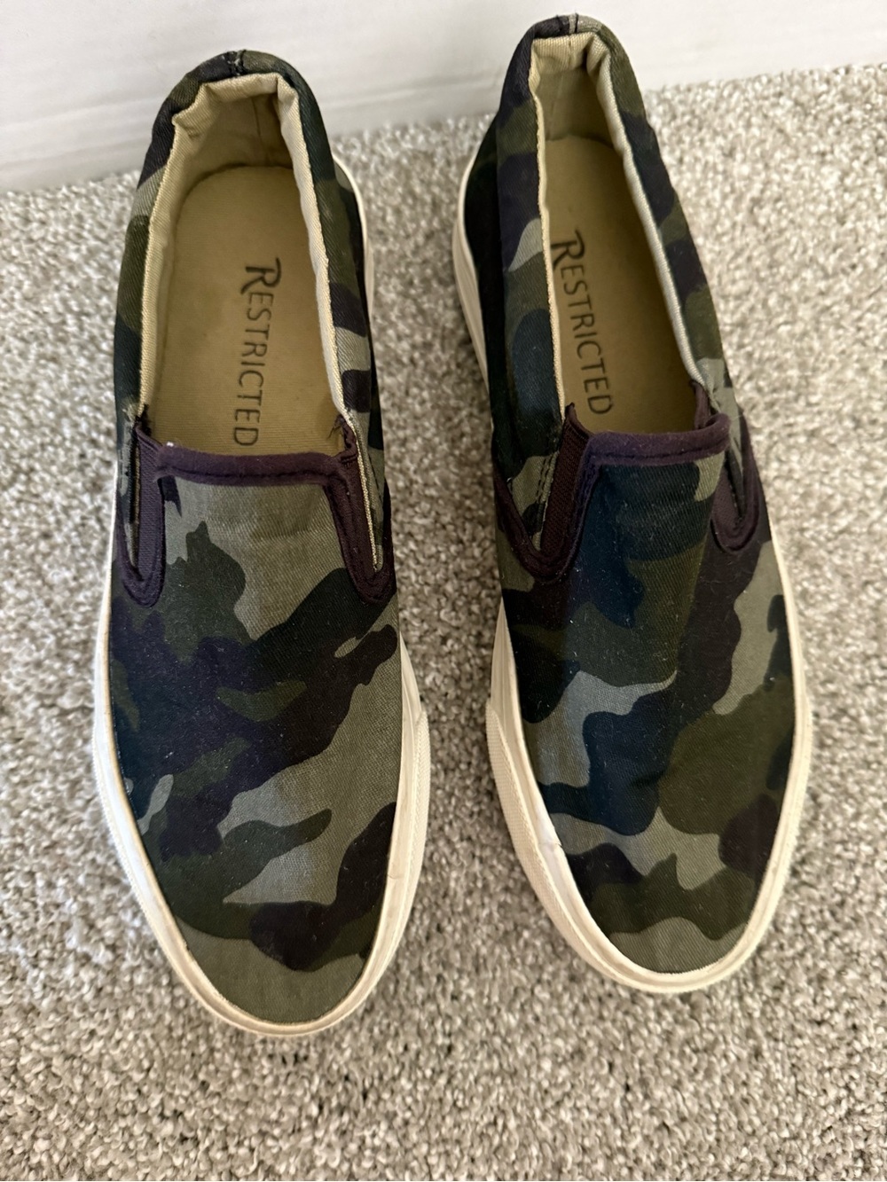 Restricted Women’s Camouflage Slip-On Sneakers in Olive and Black